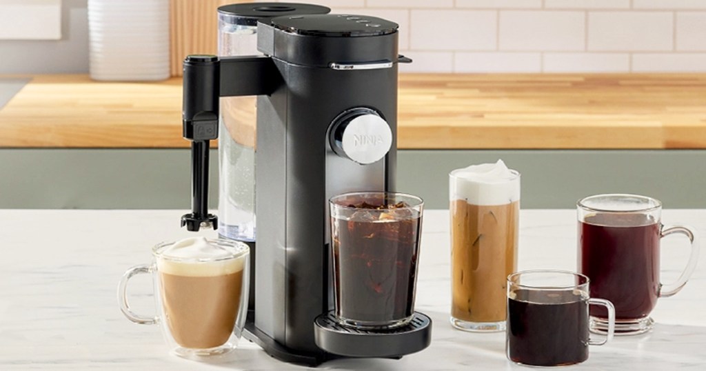 ninja coffee maker with multiple cups of coffee around it