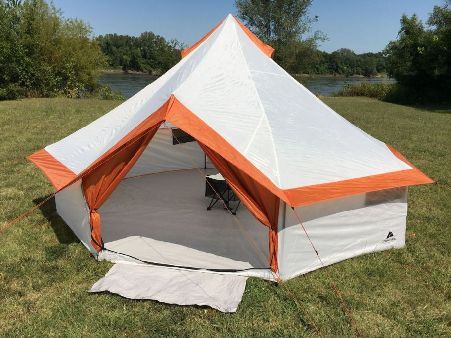 A large yurt in a field 