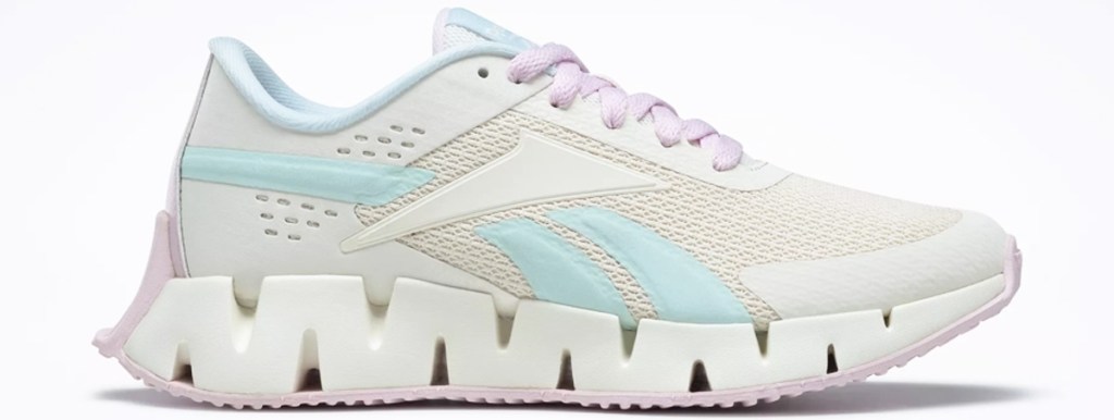 white reebok shoe with pastel purple and blue accents