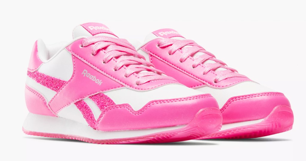 pair of pink and white reebok sneakers