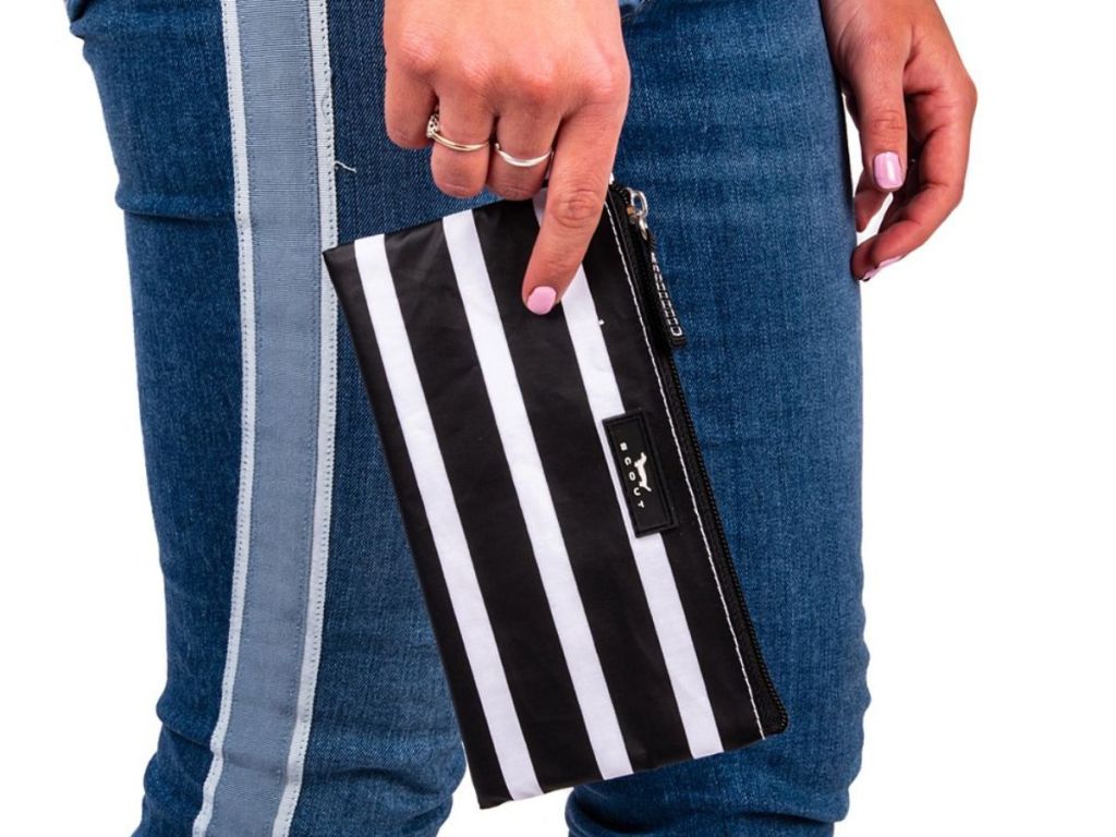 person carrying Scout by Bungalow Fleetwood Black Stripe Kate Wristlet Wristlet