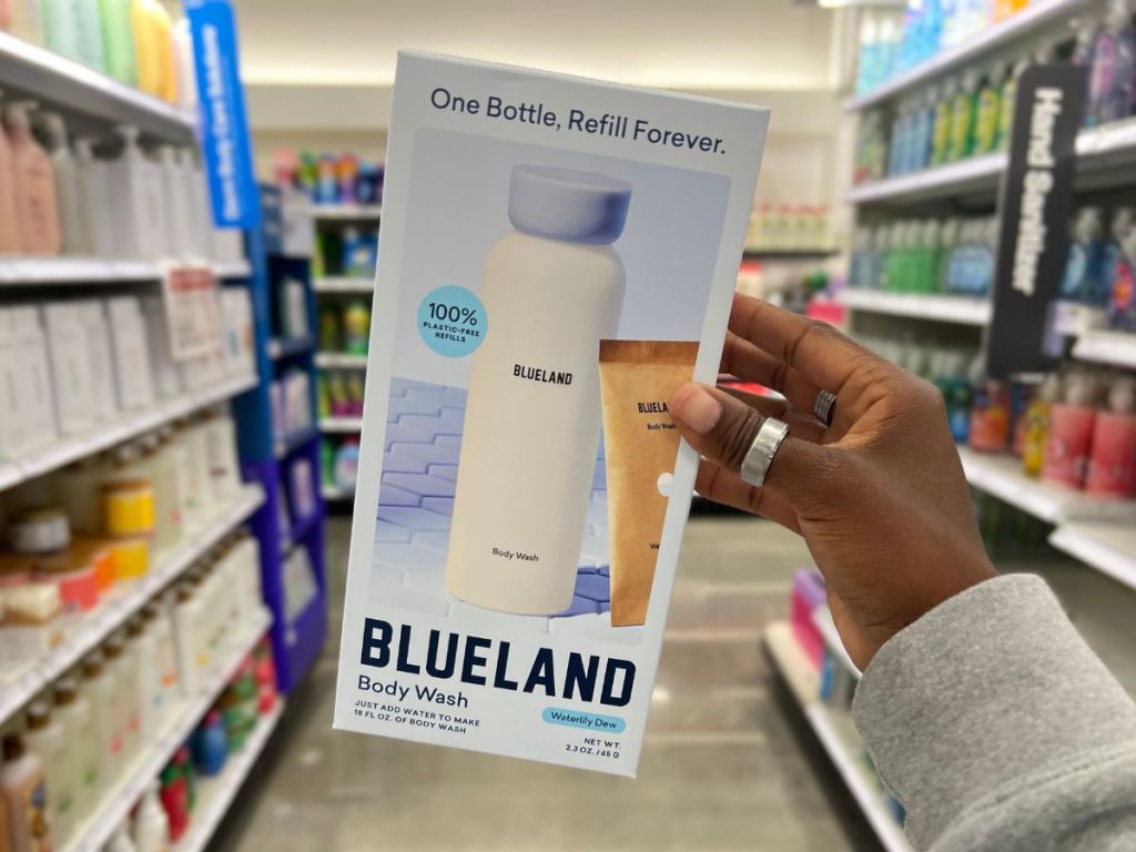 A hand Holding Blueland Body Wash