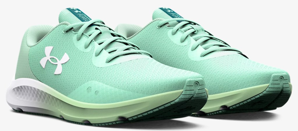pair of seafoam green under armour running shoes
