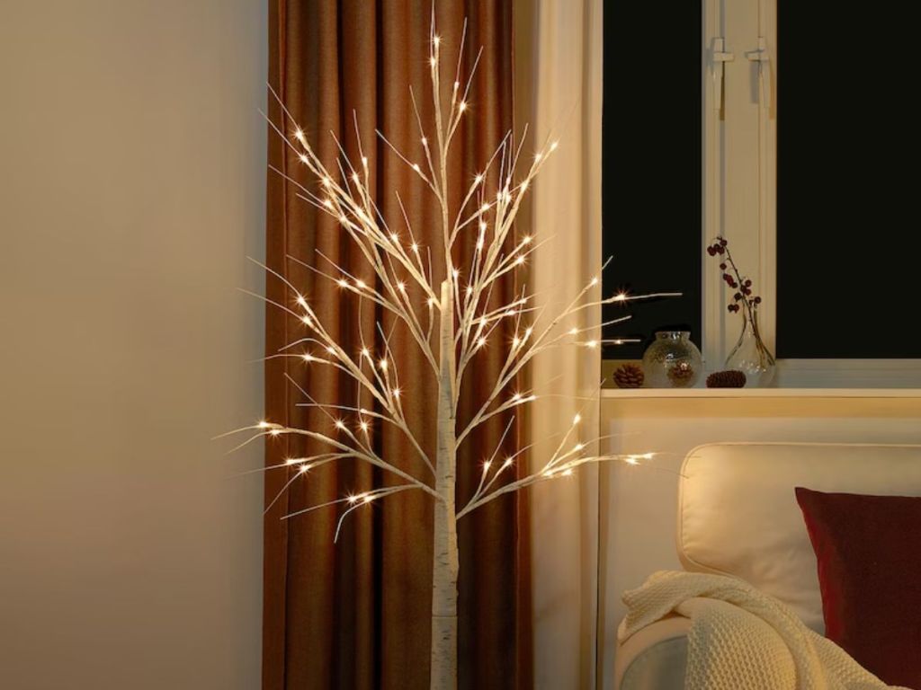 lighted birch tree in living room