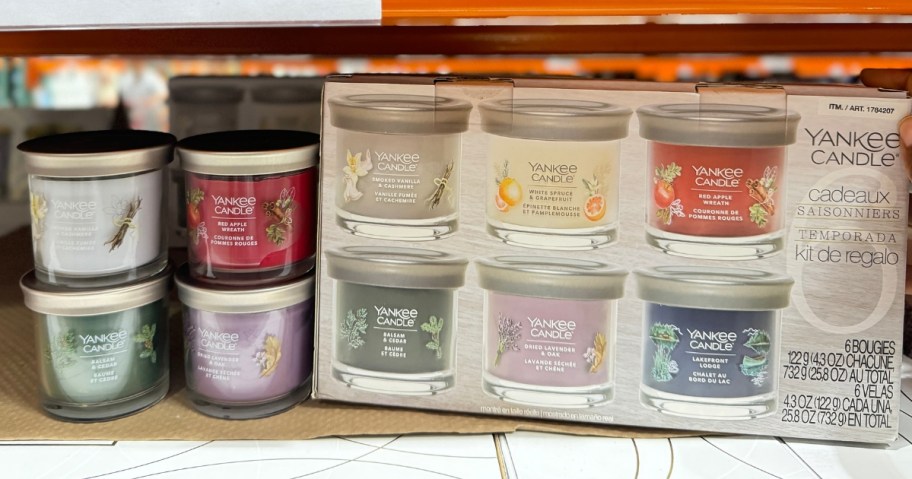 Yankee Candle 6 piece set in a box next to some of the candles on a shelf at Costco