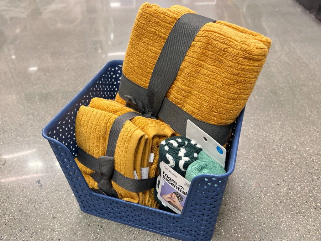 basket filled with house items on the floor