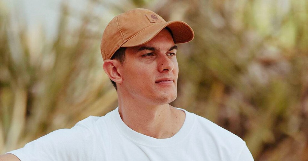 man wearing tan carhartt hat and white tee