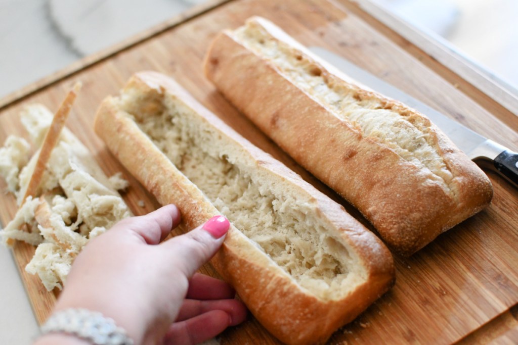 cutting the top and inside of bread