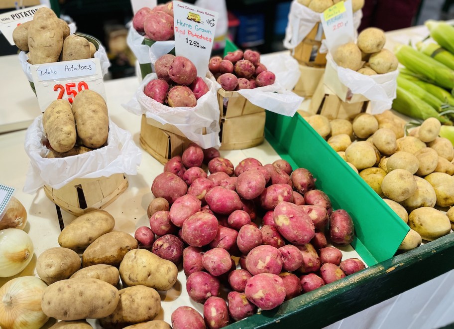various kinds of potatoes on farmers market stand