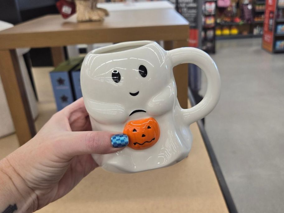 ghost mug in hand in store