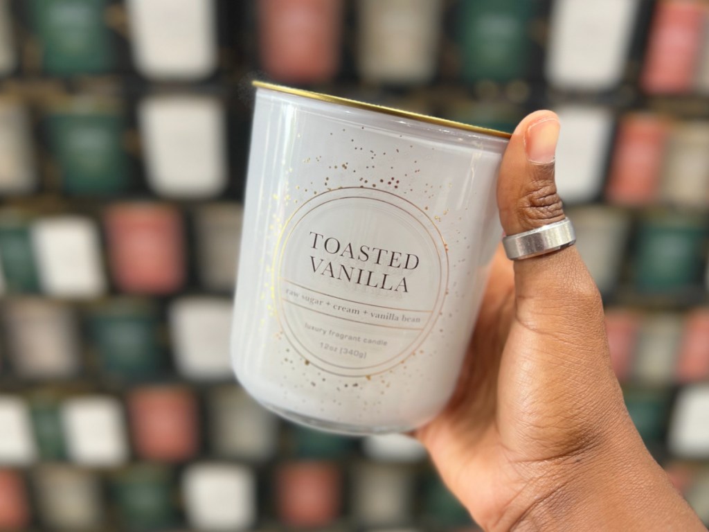 hand holding Bellevue Luxury Candle in toasted vanilla