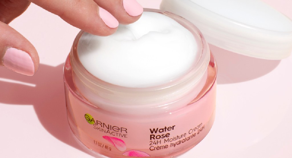 hand touching garner new water rose cream