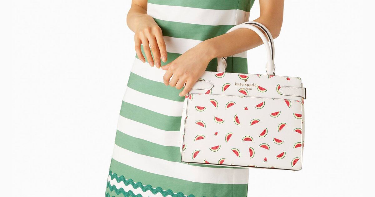 woman wearing green and white striped dress carrying kate spade watermelon bag