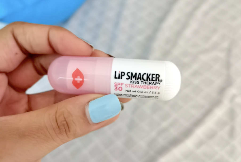 holding Lip Smacker kiss therapy