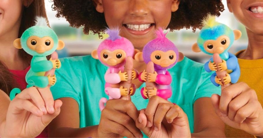 3 kids with the 4 new fingerlings monkeys on their fingers