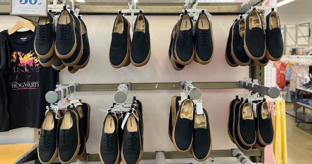old navy boys black tie up shoes hanging in store