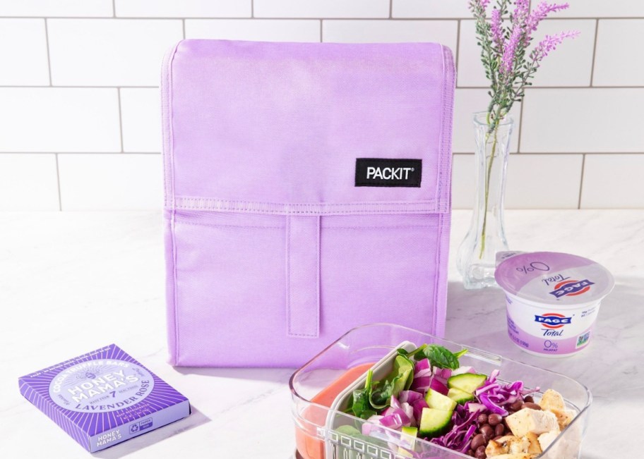 purple packit lunch bag sitting on countertop with food