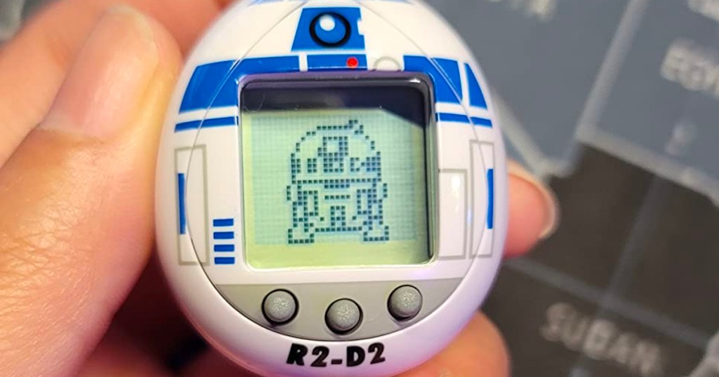 r2d2 tamagotchi in hand