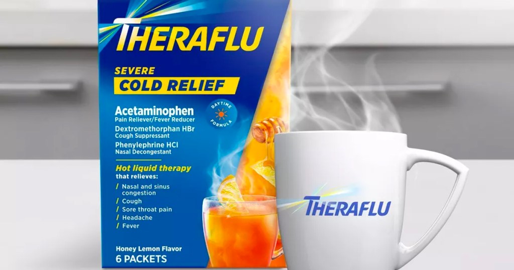 theraflu daytime relief packets box next to coffee mug