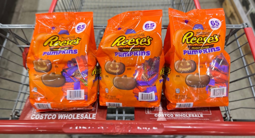 three bags of Reeses 65 pieces in costco cart