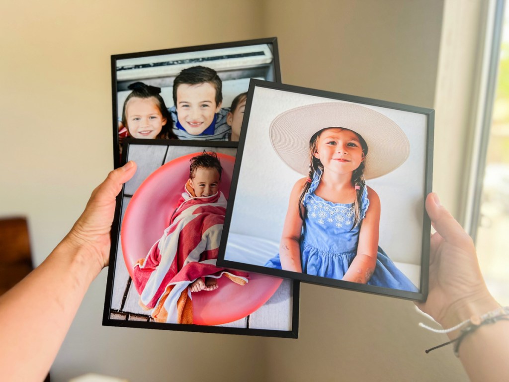 woman holding tilepix featuring images of children