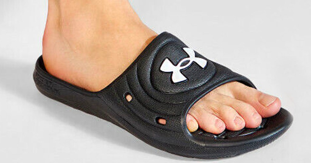 foot wearing under armour black slide