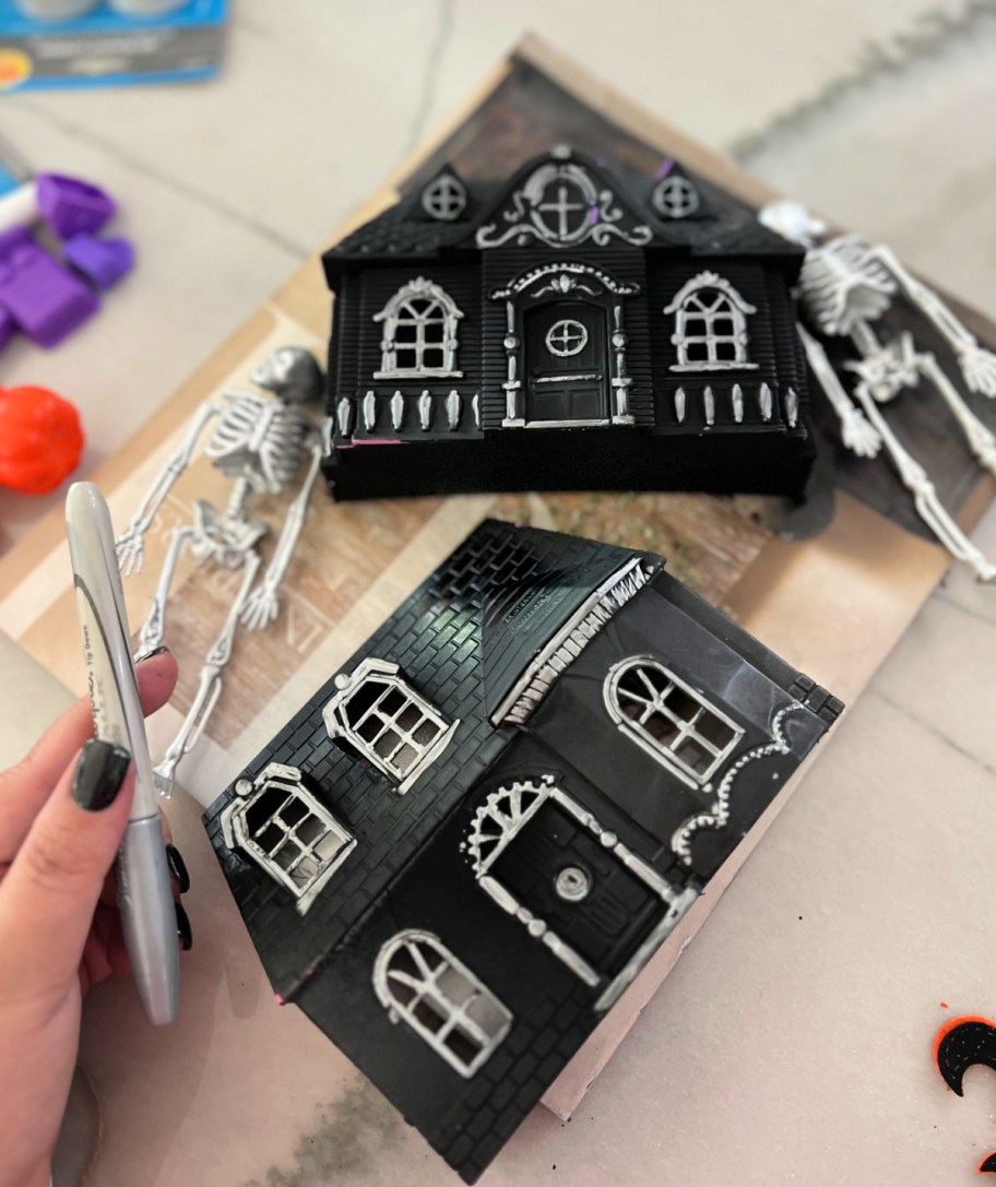 using a silver sharpie to decorate dollar tree diy halloween decor