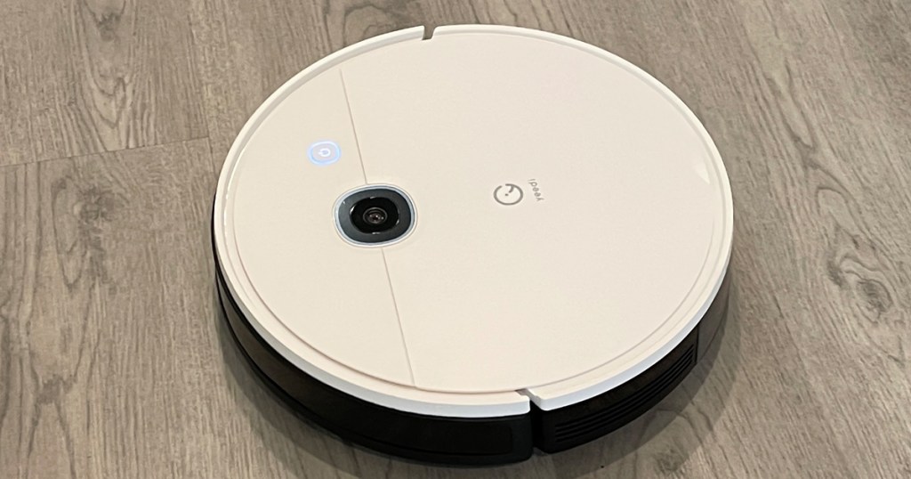 white yeedi robot vacuum cleaning floor