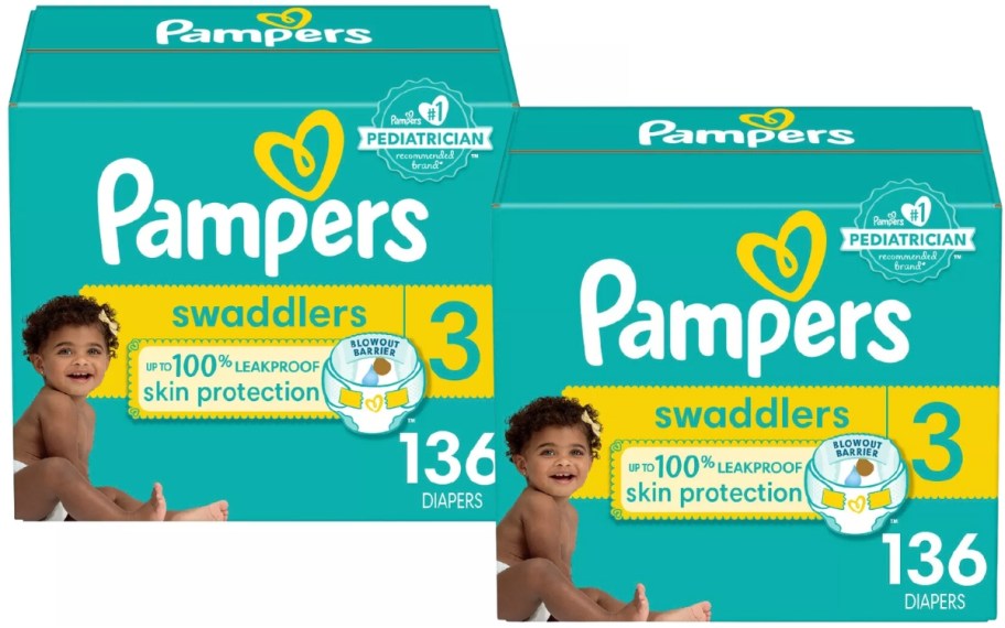 2 green and yellow large boxes of Pampers Diapers with a baby girl in a diaper on the cover