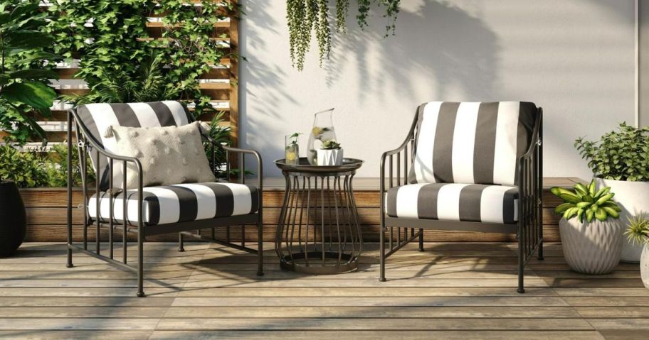 patio seat set with black and white striped cushions and end table