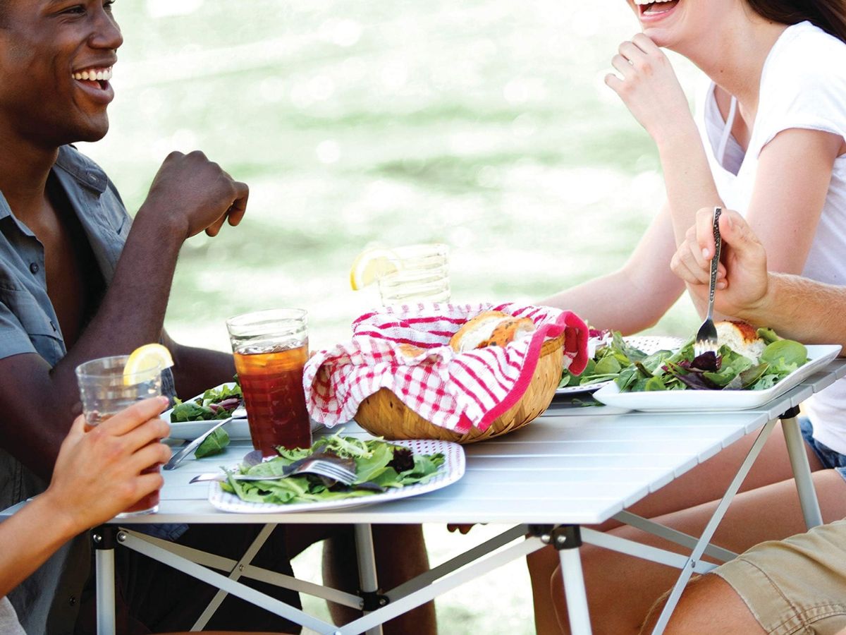 People eating at a Coleman aluminum table