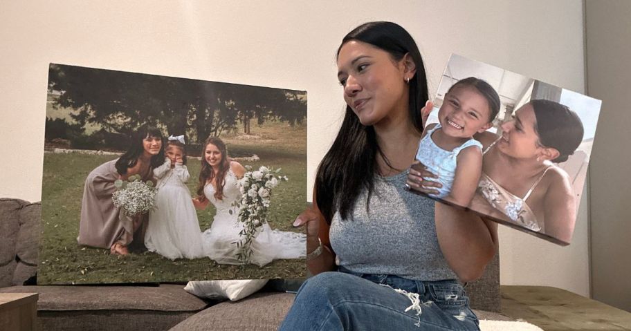 Monica holding custom canvas prints made by Canvas Champ