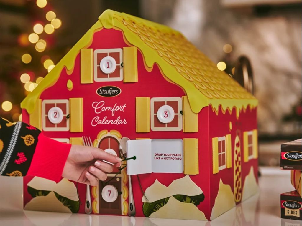 Stouffer's Comfort Calendar Advent Calendar shown with hand opening a door