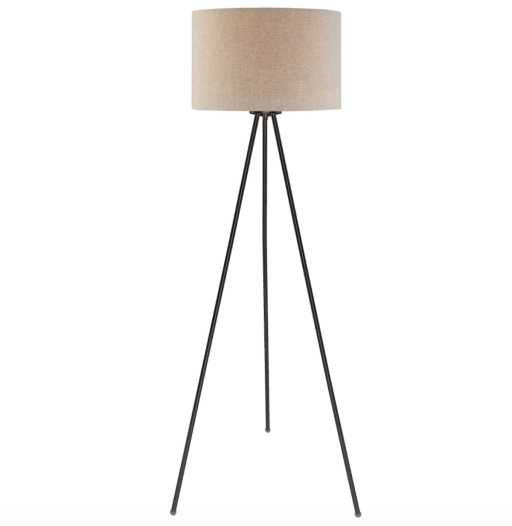 stock photo of tripod floor lamp