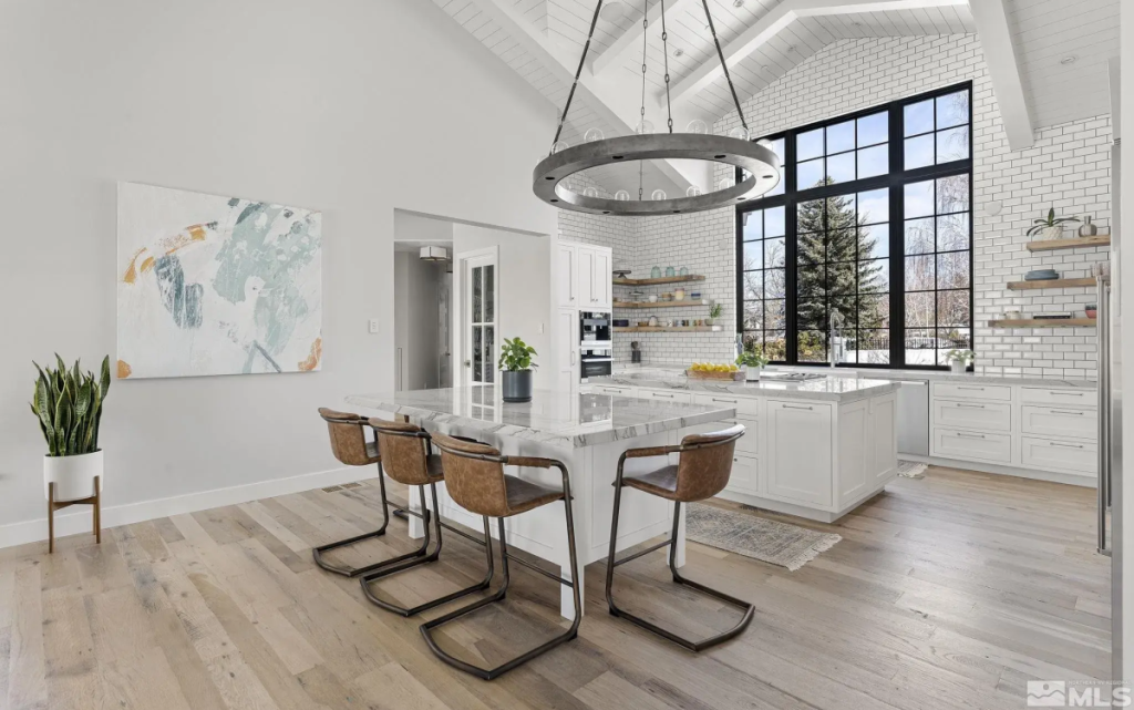 A kitchen with Mercury Row Queens Boulevard Counter Height Stools