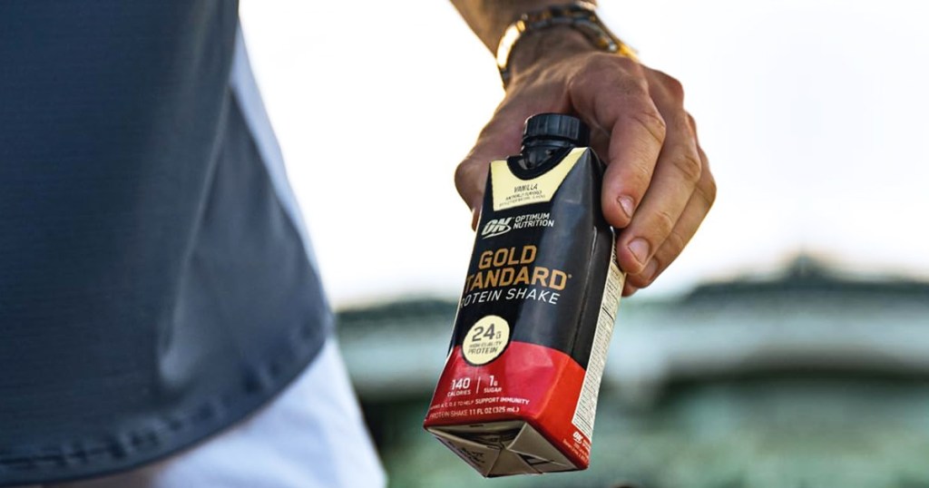 hand holding Optimum Nutrition Gold Standard Premade Protein Shake