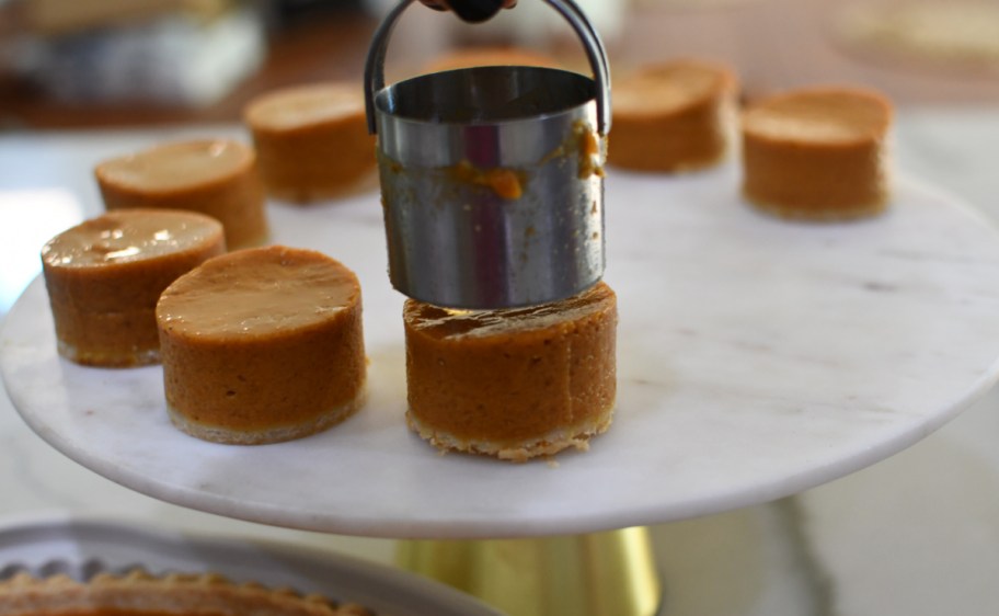 Removing pumpkin pie bites from a biscuit cutter