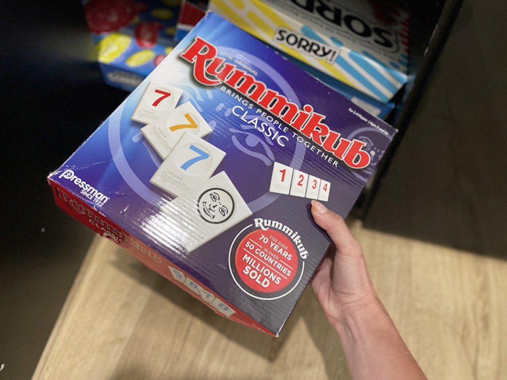 hand holding rummikub game in box