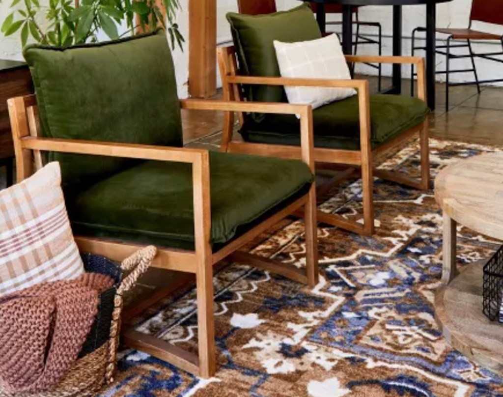 two olive green velvet accent chairs in living room