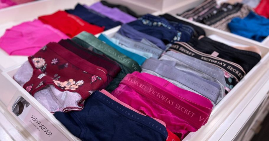 Lots of pairs of folded Victoria's Secret Underwear