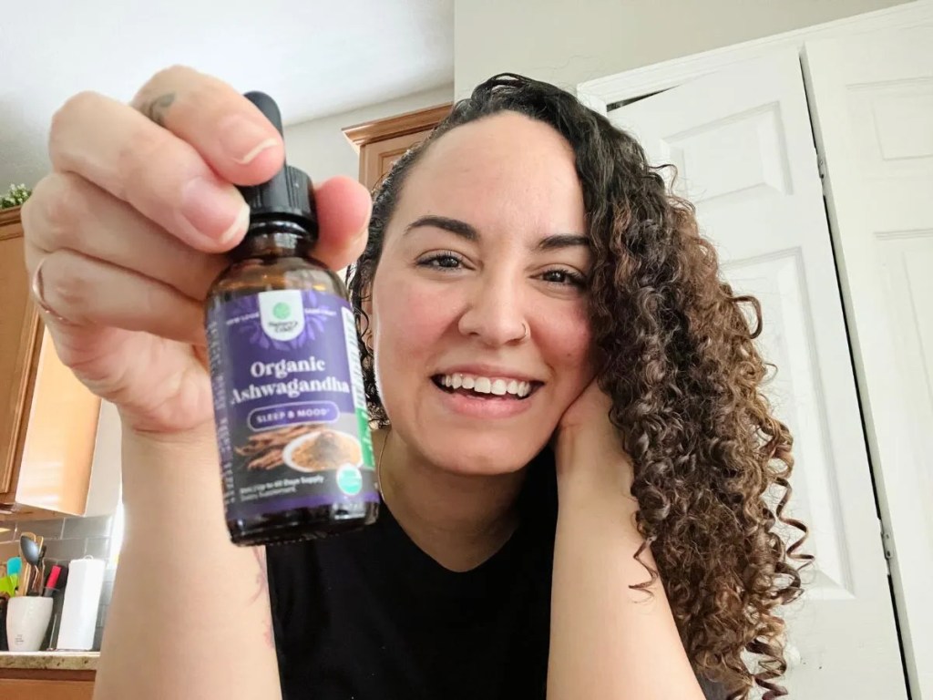 Woman Holding Nature's Craft Ashwagandha Drops