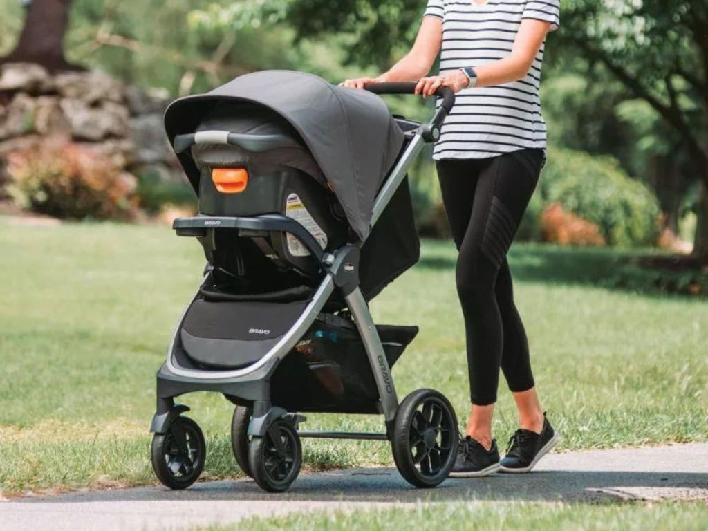 Woman pushing a baby stroller outside