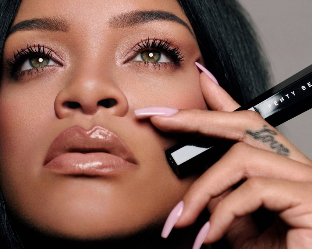 rihanna holding mascara on cheek