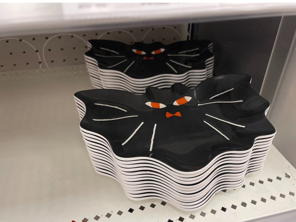 hand holding Hyde & EEK! Boutique Halloween Bat Dinner Plate at the store