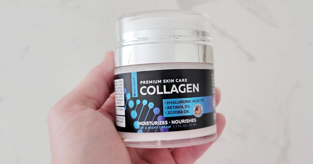 hand holding raw science collagen jar