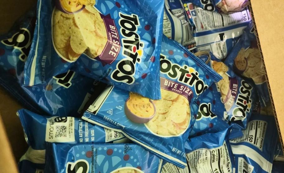 a cardboard box filled with 1oz bags of bitesize tostitos