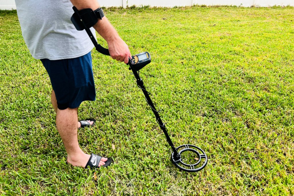 man using a uhlund metal detector