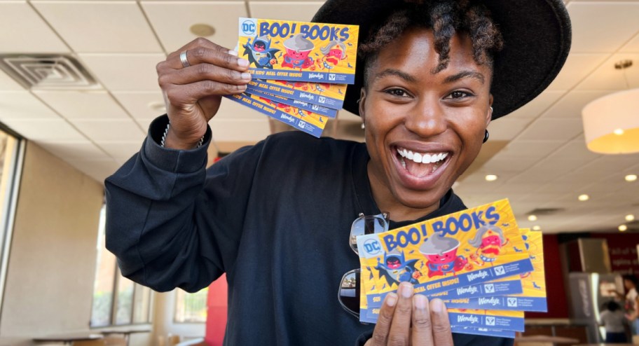 woman holding wendys boo books and tickets - what to buy in september