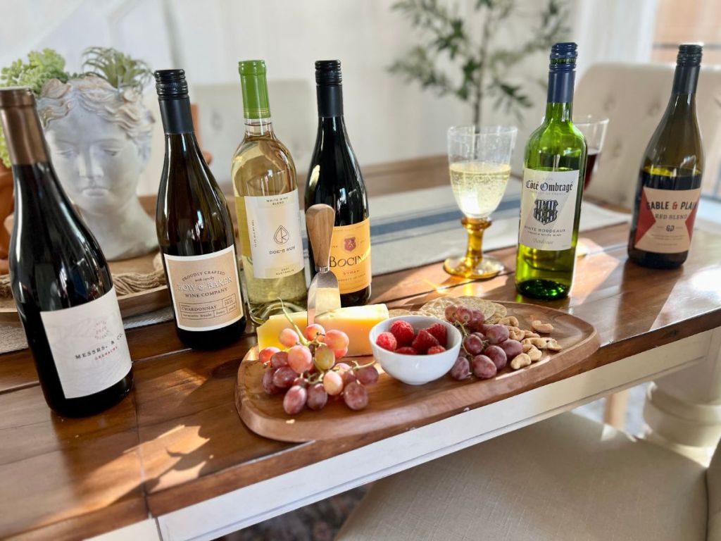 Swirl Wine Bottles behind a Charcuterie board