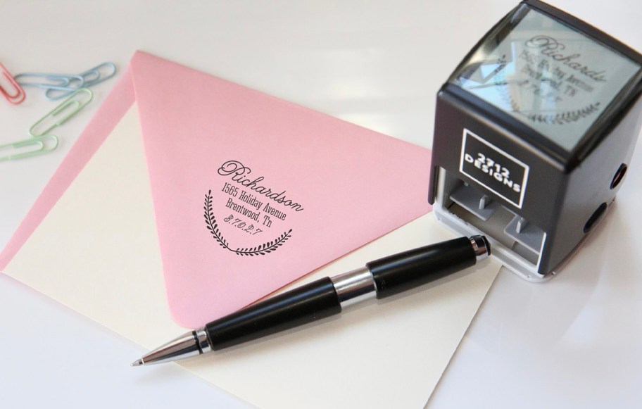 square stamp with envelope and pen